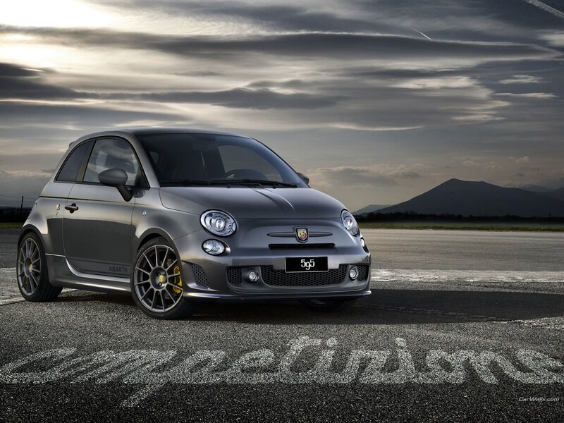 Gray Fiat 595 on a racetrack