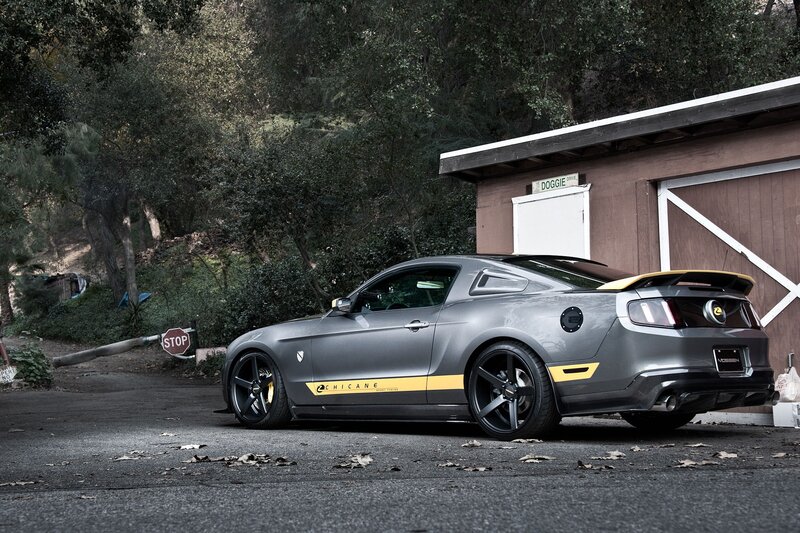 gray ford mustang with yellow accents