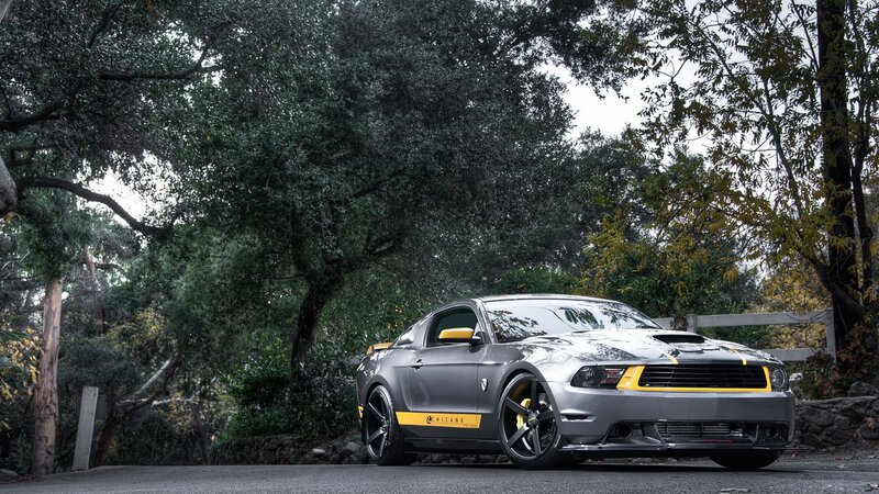 gray ford mustang with yellow accents