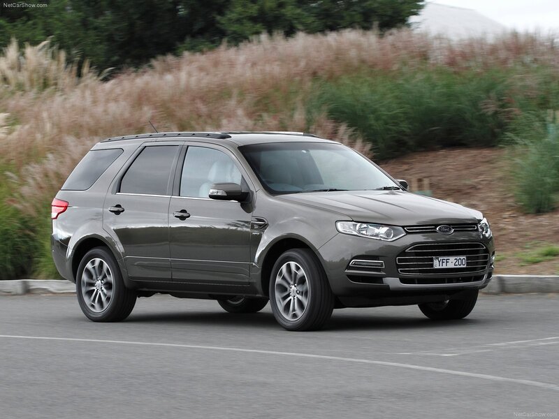 gray ford suv on road