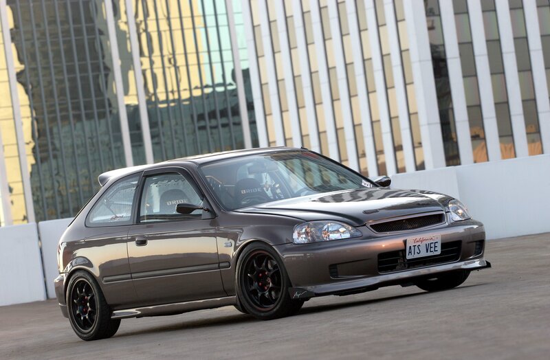 gray hatchback car in city