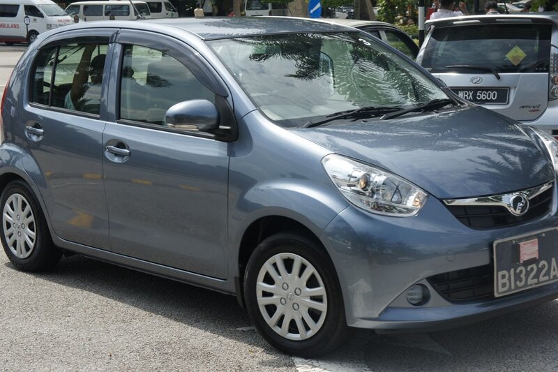 Gray hatchback car on street