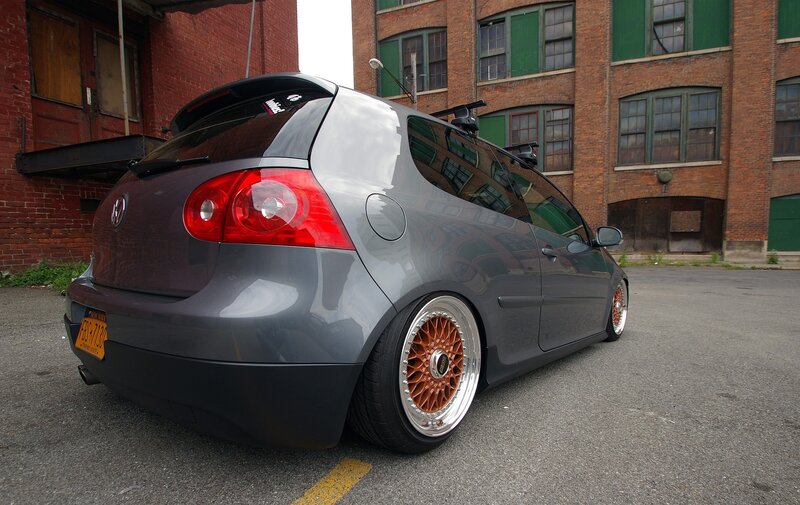 gray hatchback with custom wheels
