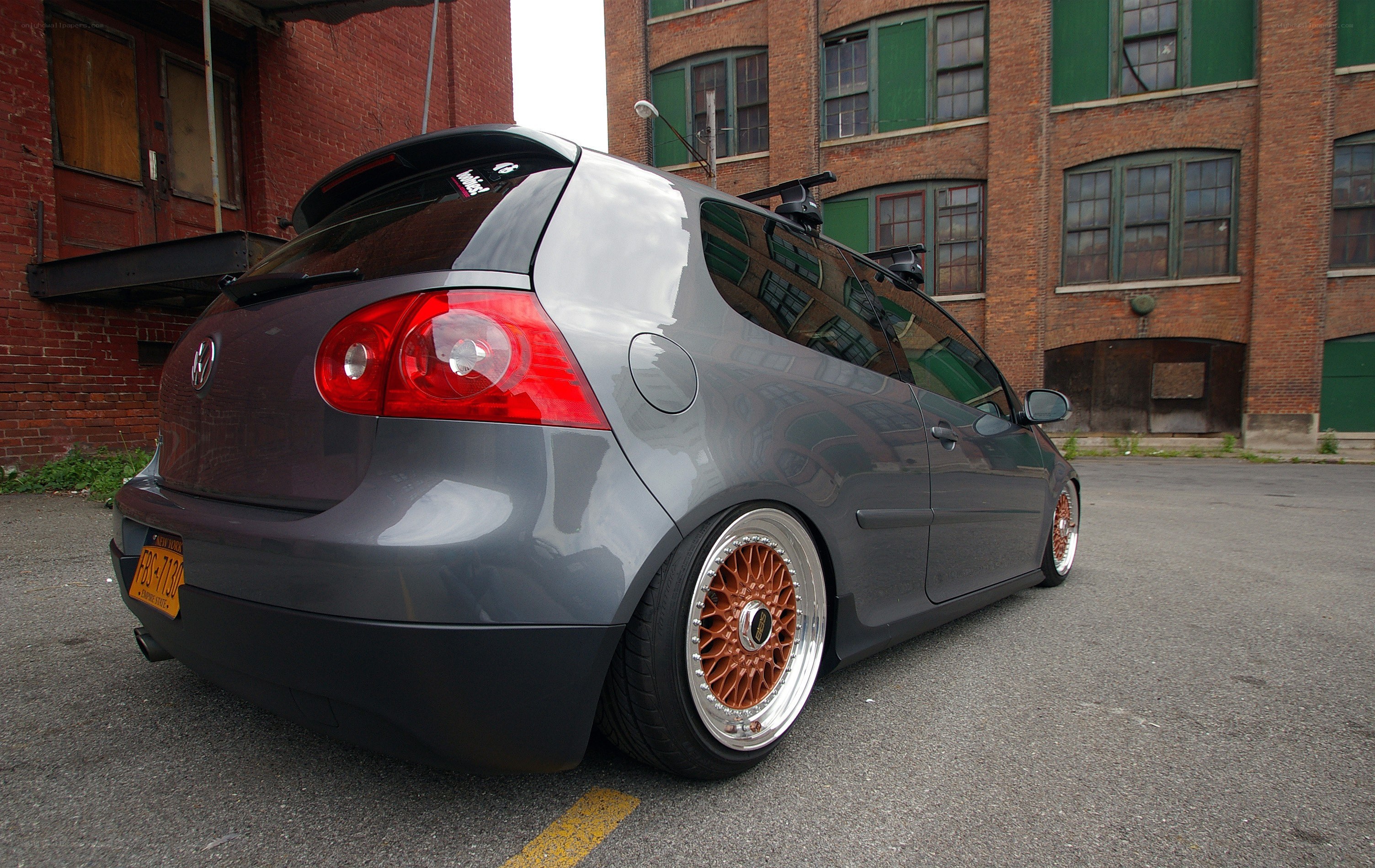 gray hatchback with custom wheels