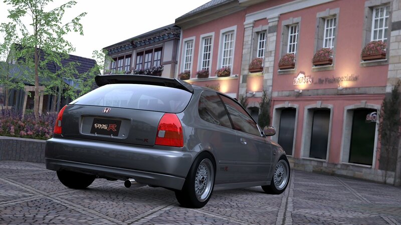 Gray Honda Civic Type R on cobblestone street
