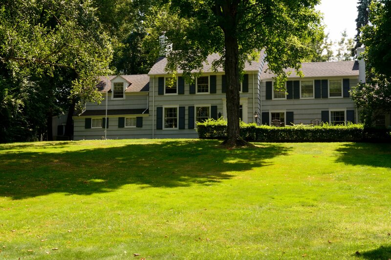 Gray House with Green Lawn