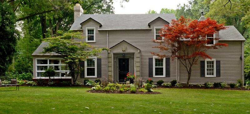 Gray House with Red Tree