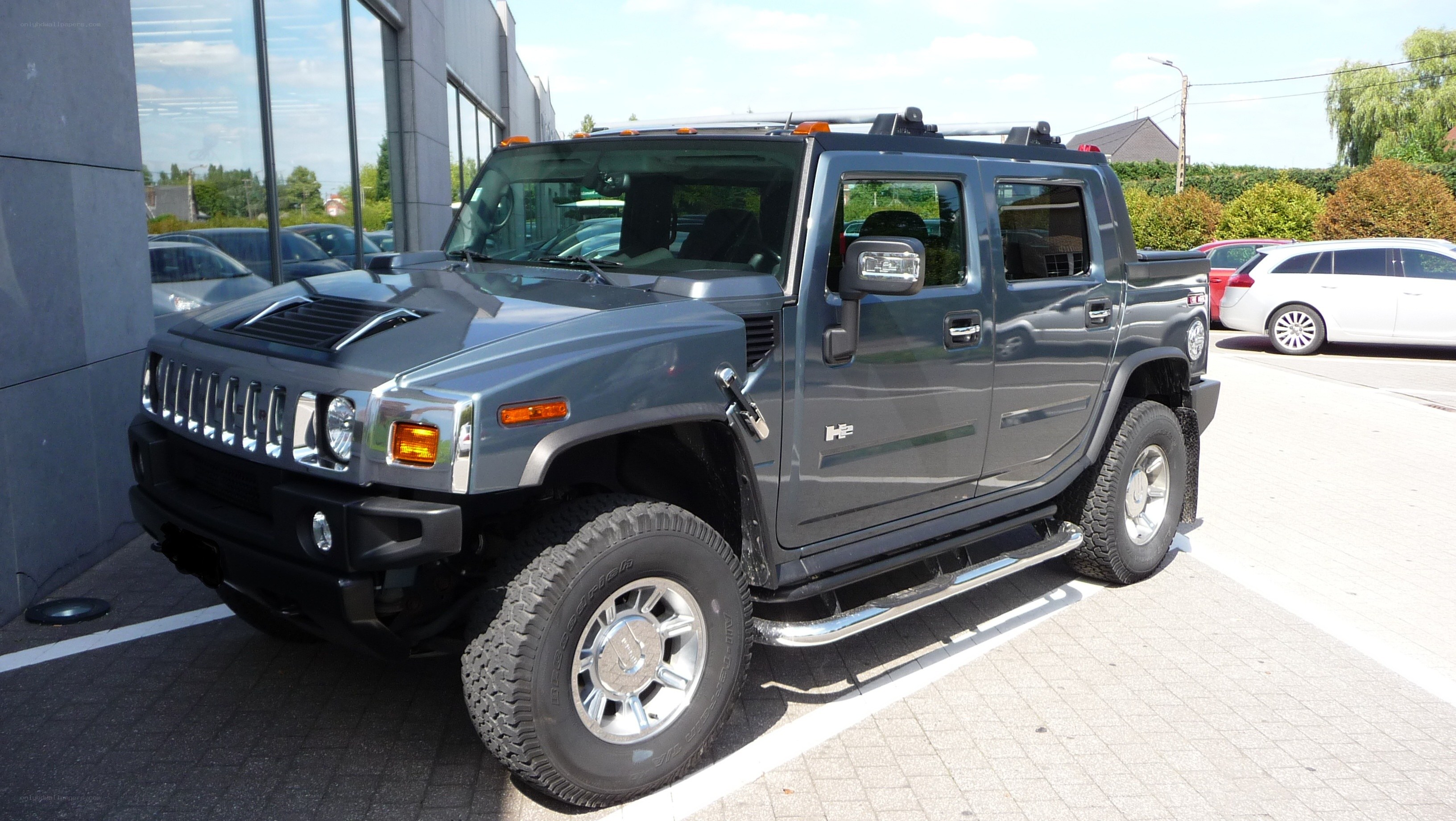 Gray Hummer H2 parked outside
