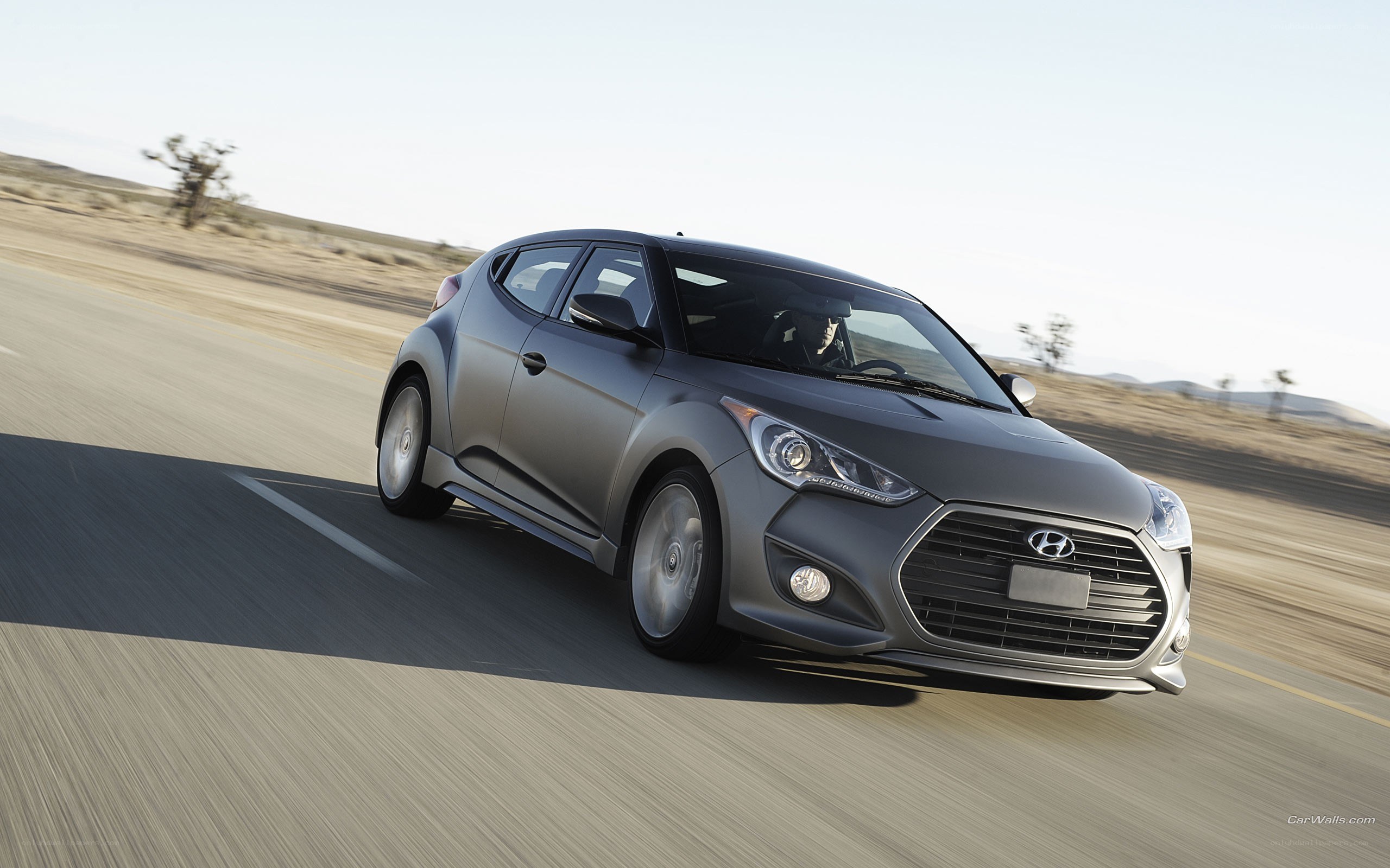 gray hyundai veloster in motion