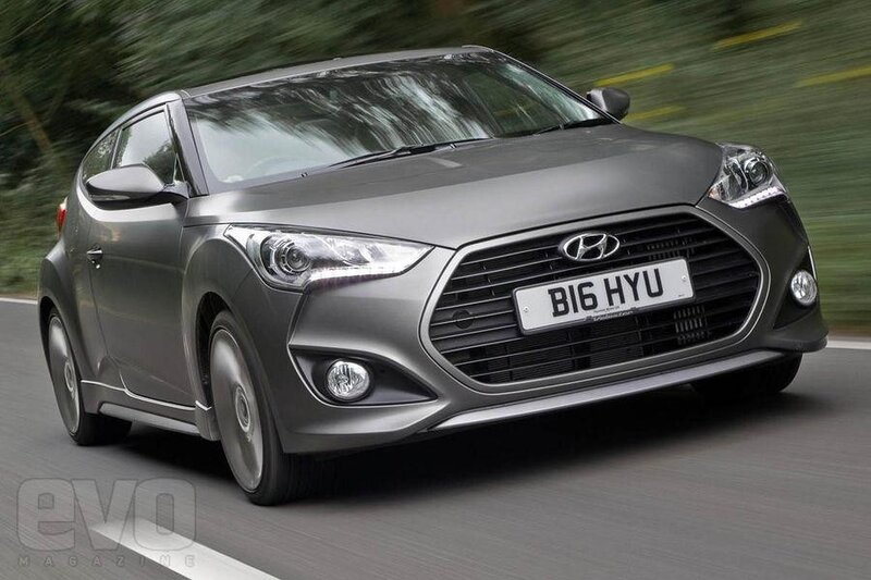 Gray Hyundai Veloster in motion