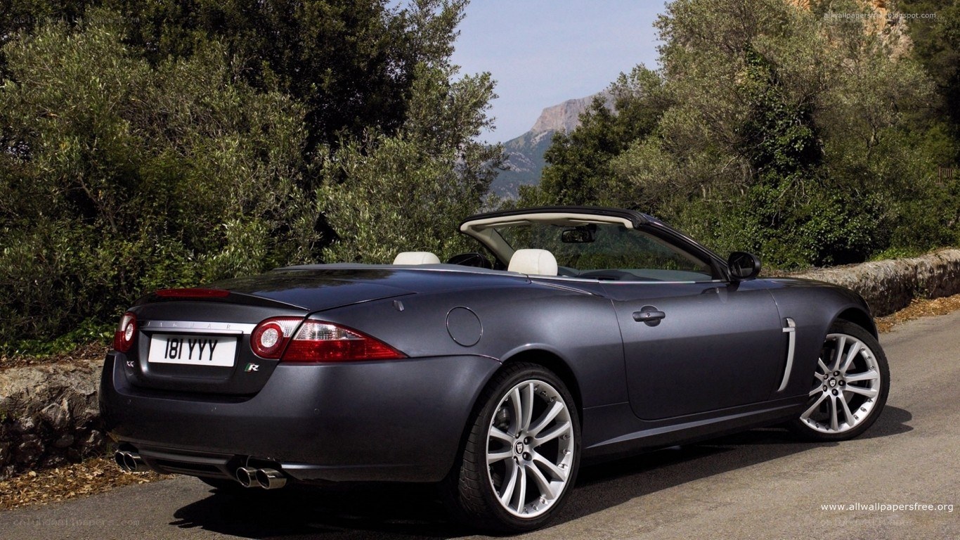 gray jaguar convertible on road
