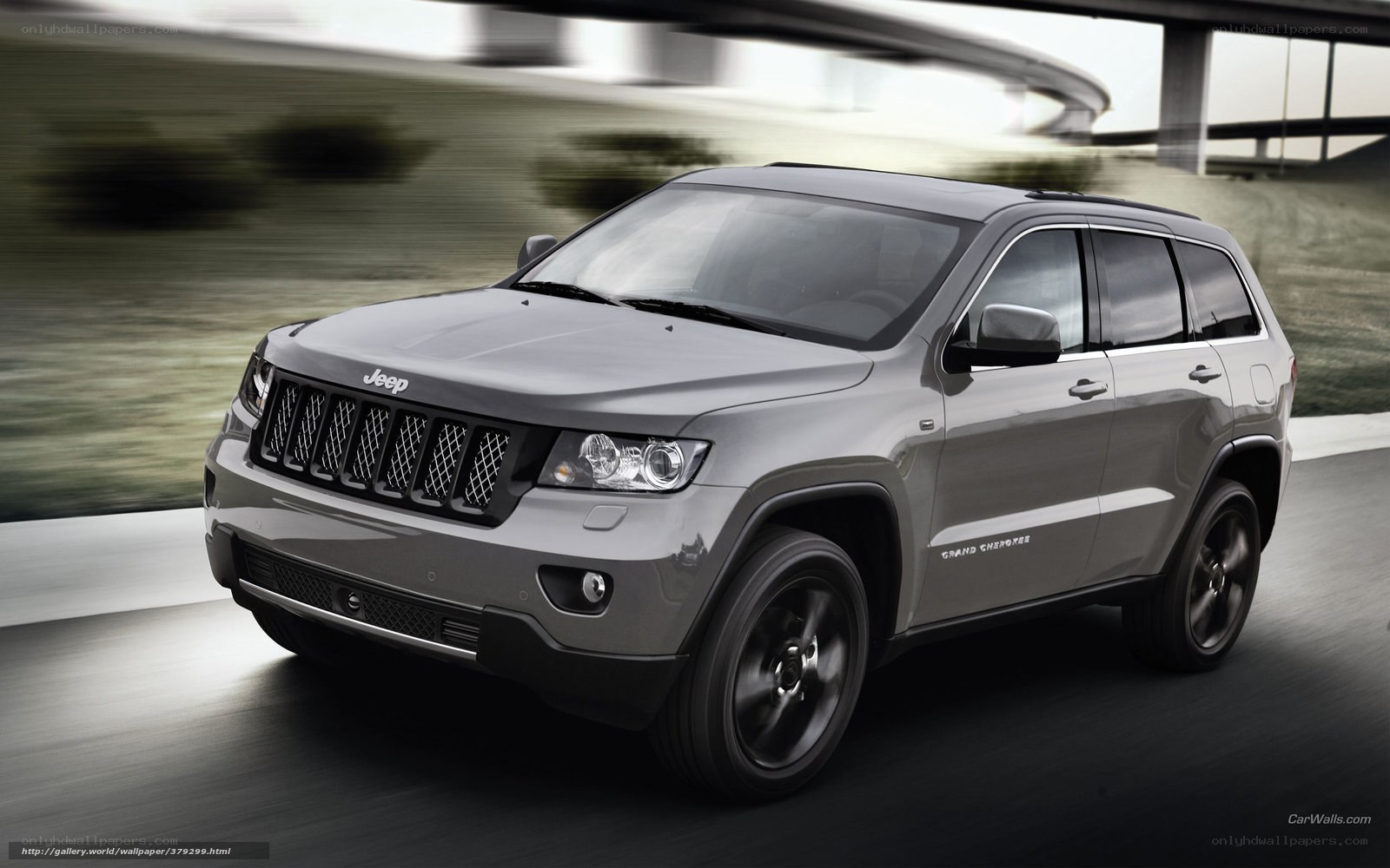 Gray Jeep Grand Cherokee in motion