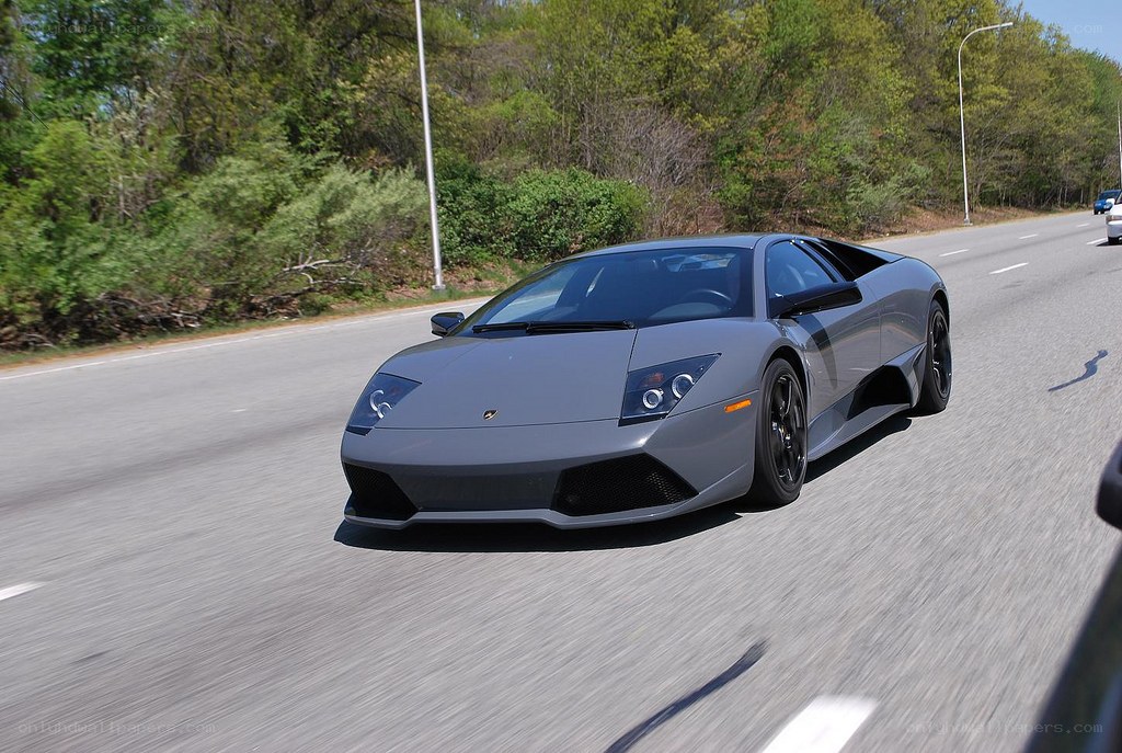 gray lamborghini driving on road
