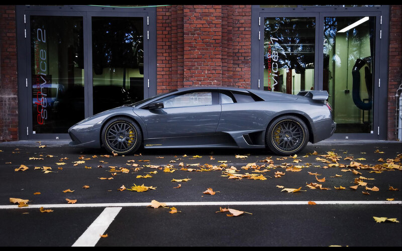 Gray Lamborghini in front of service center