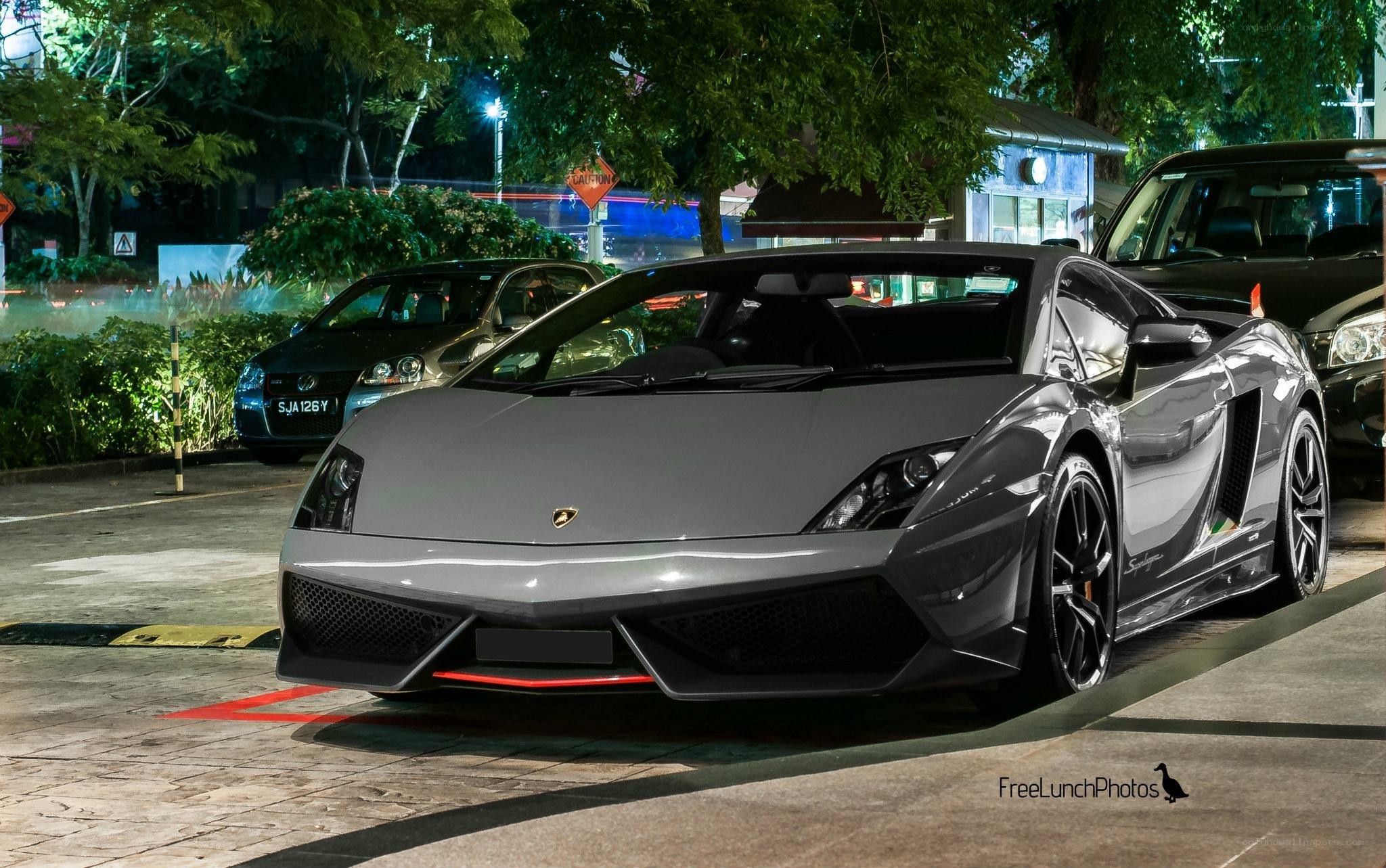 Gray Lamborghini in parking lot