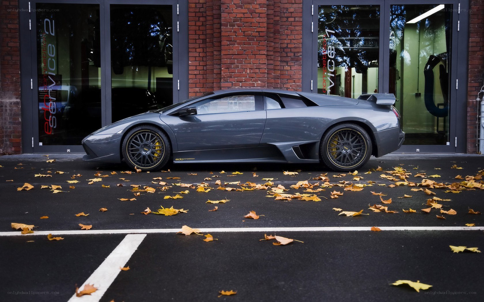 Gray Lamborghini in parking lot