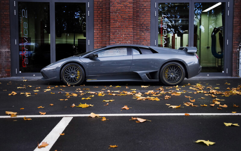 Gray Lamborghini in parking spot