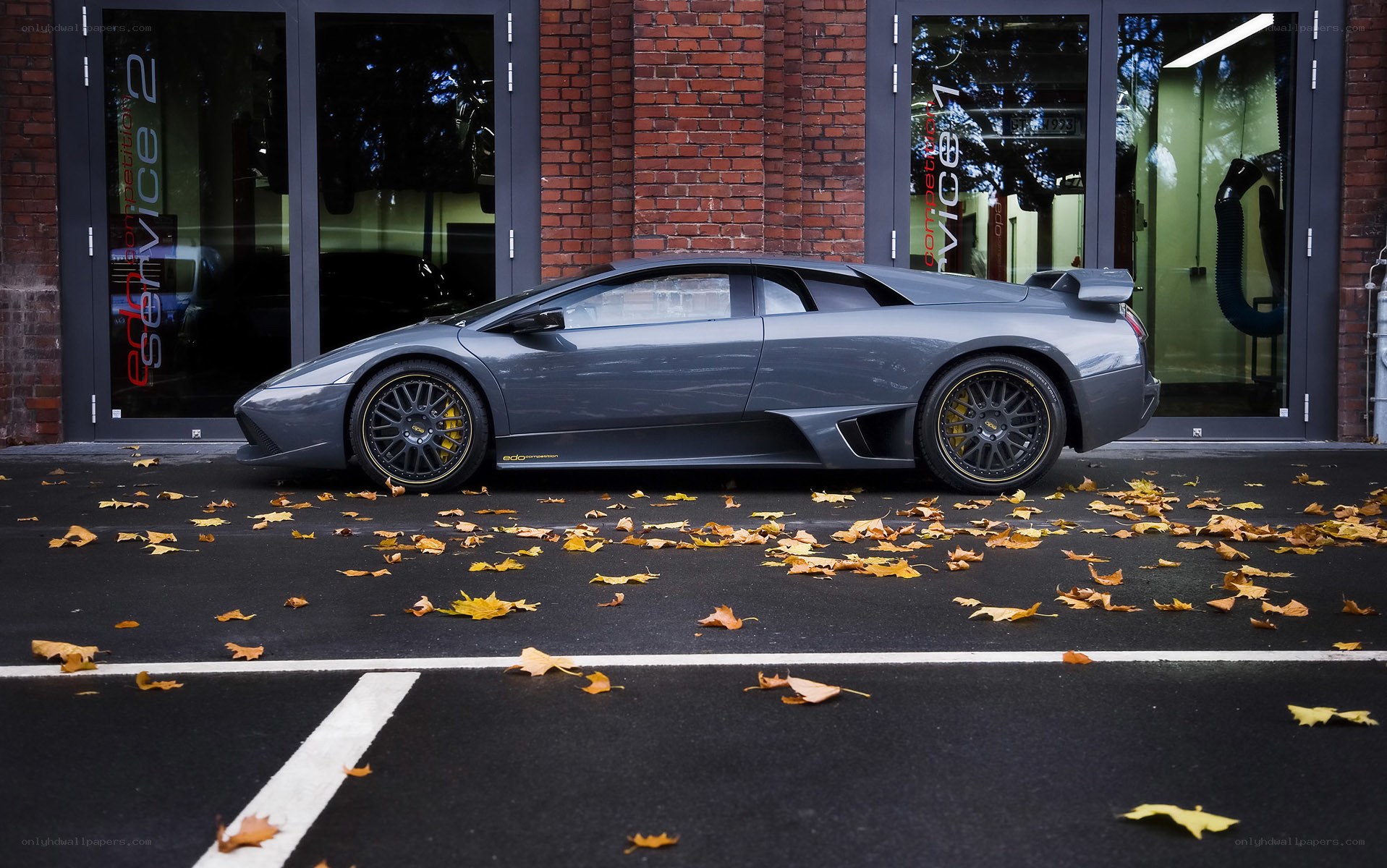 Gray Lamborghini in parking spot