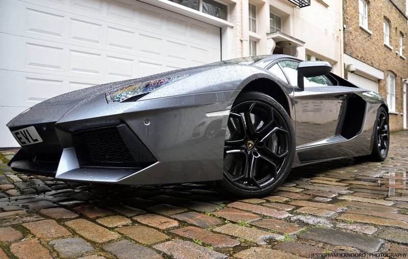gray lamborghini on cobblestones