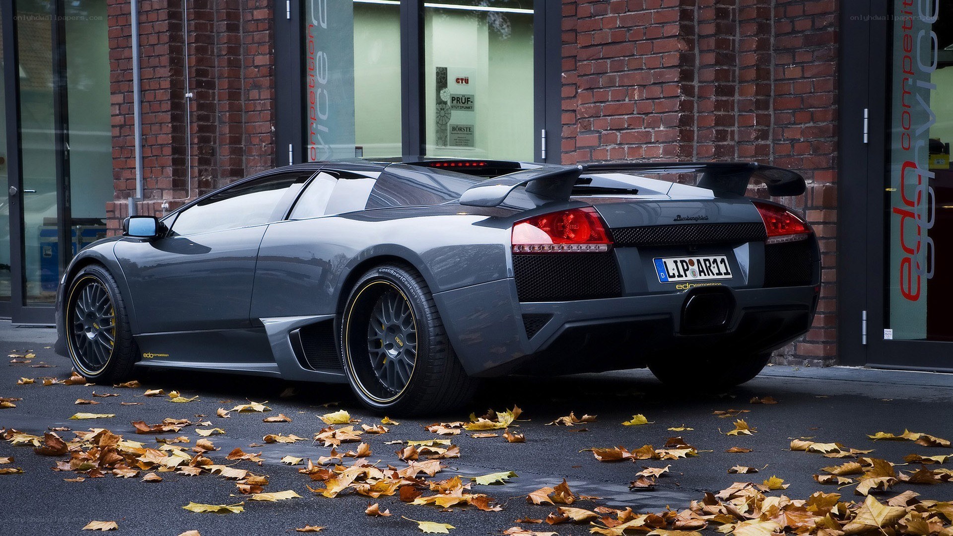 gray lamborghini parked on street