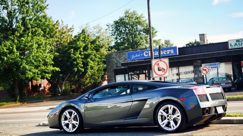 gray lamborghini parked on street