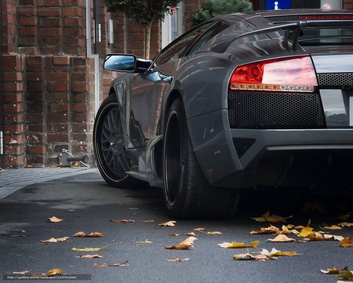 Gray Lamborghini parked on street
