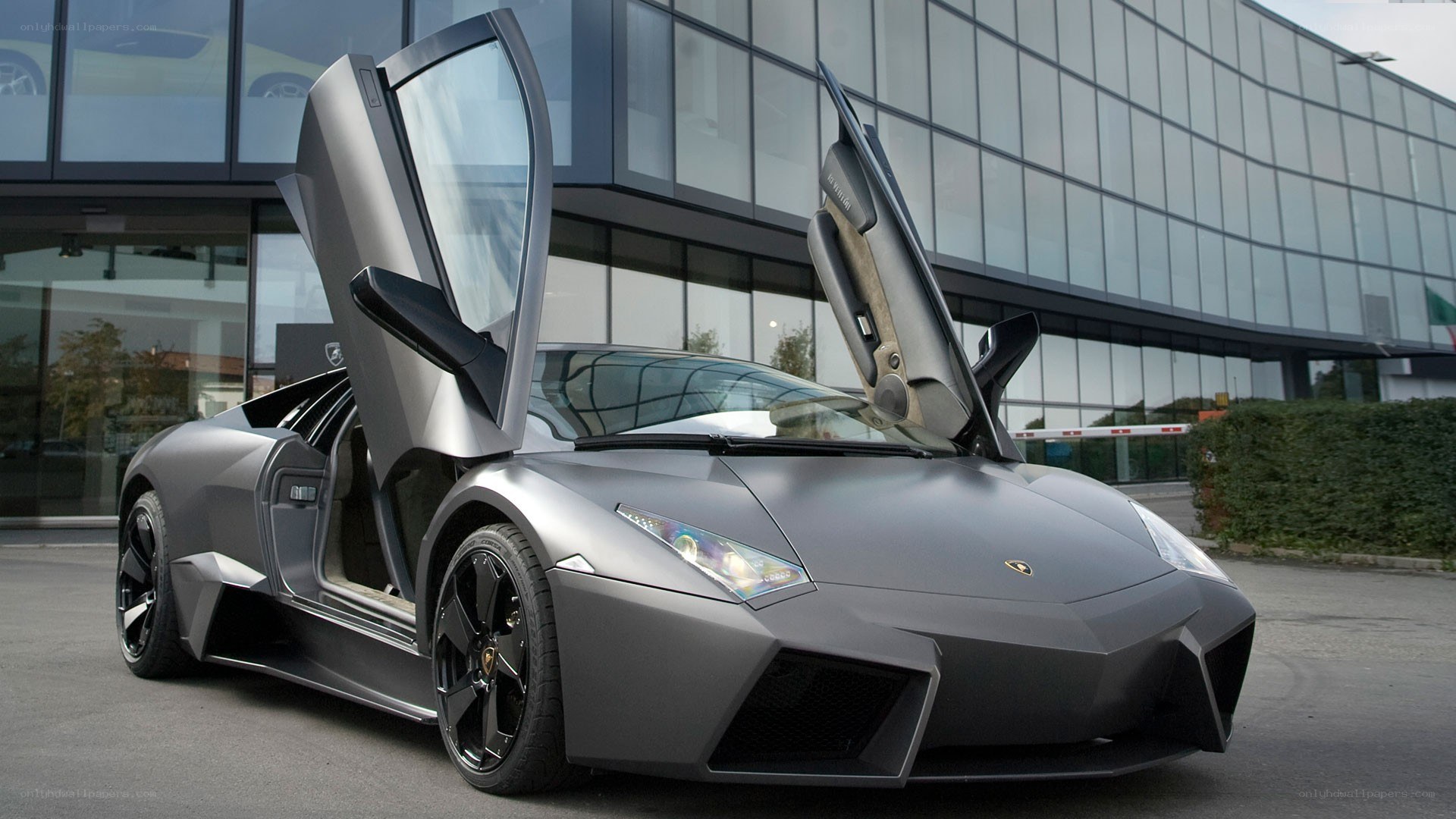 Gray Lamborghini with doors open