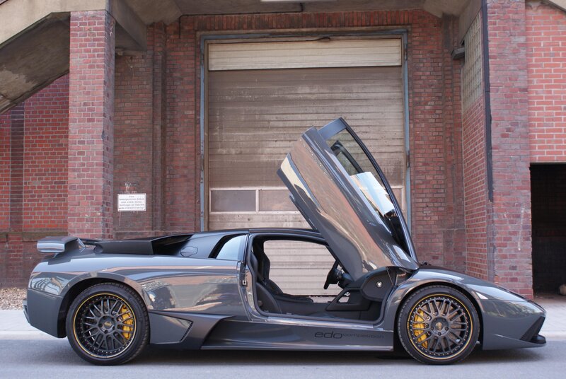 Gray Lamborghini with open door