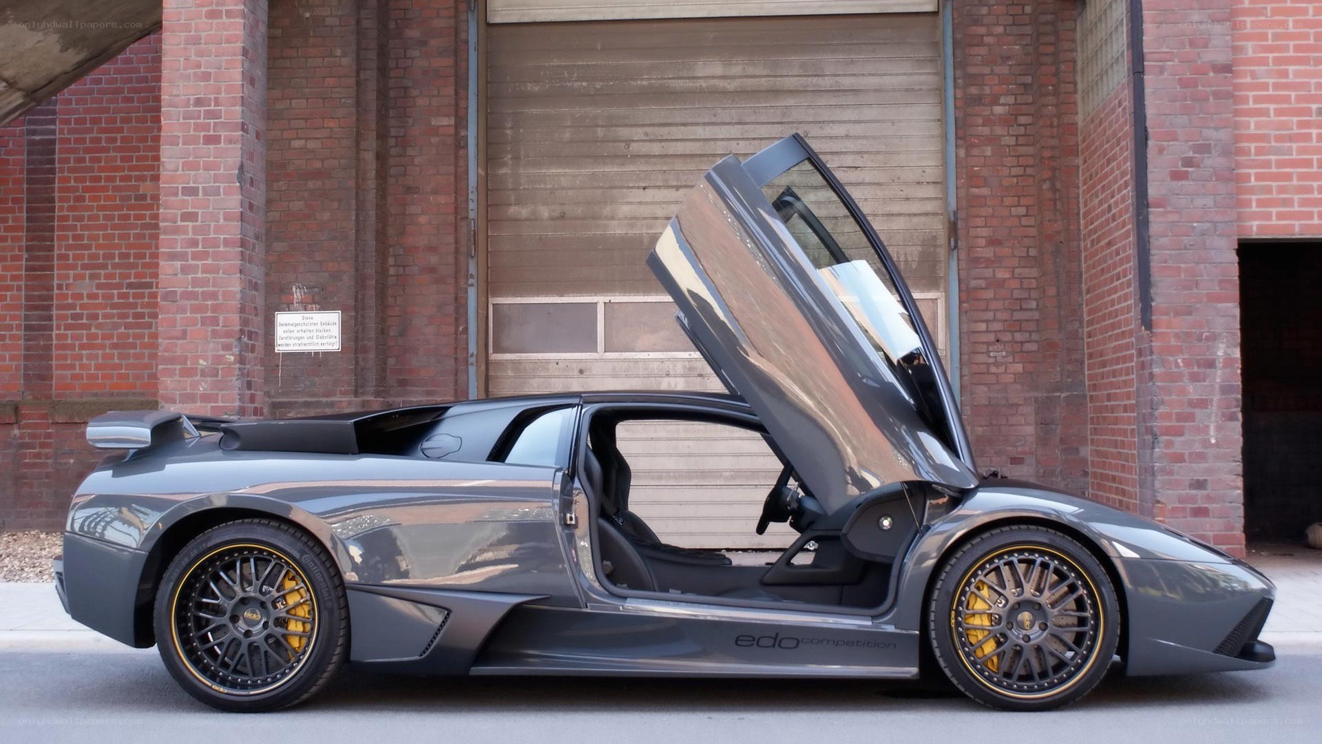 Gray Lamborghini with open doors