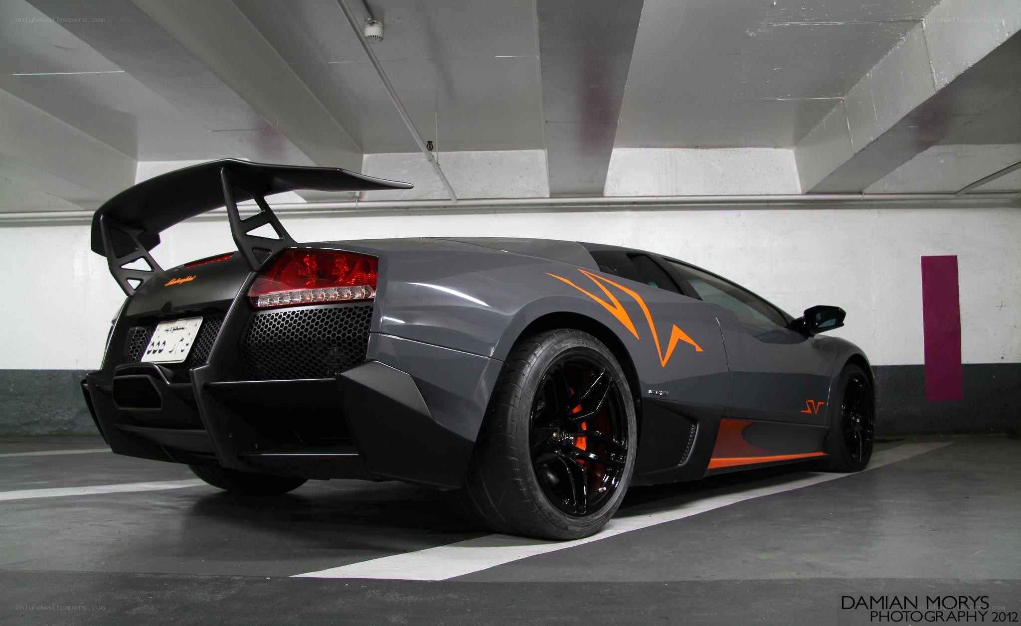 Gray Lamborghini with orange accents
