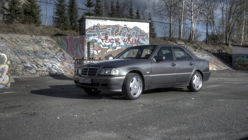 Gray Mercedes-Benz in graffiti area