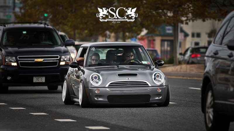 Gray Mini Cooper on city street