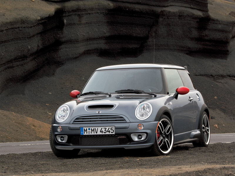 gray mini cooper on volcanic road