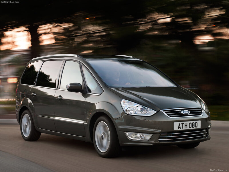 Gray Minivan in Motion