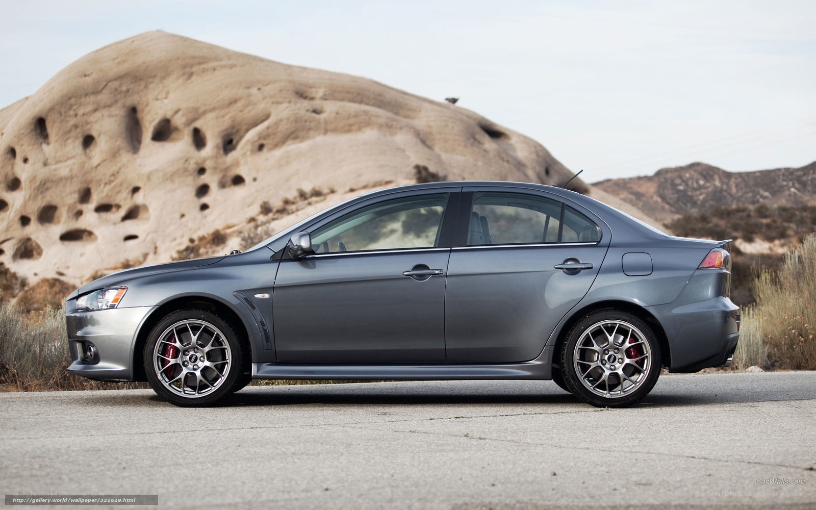 Gray Mitsubishi Lancer in desert