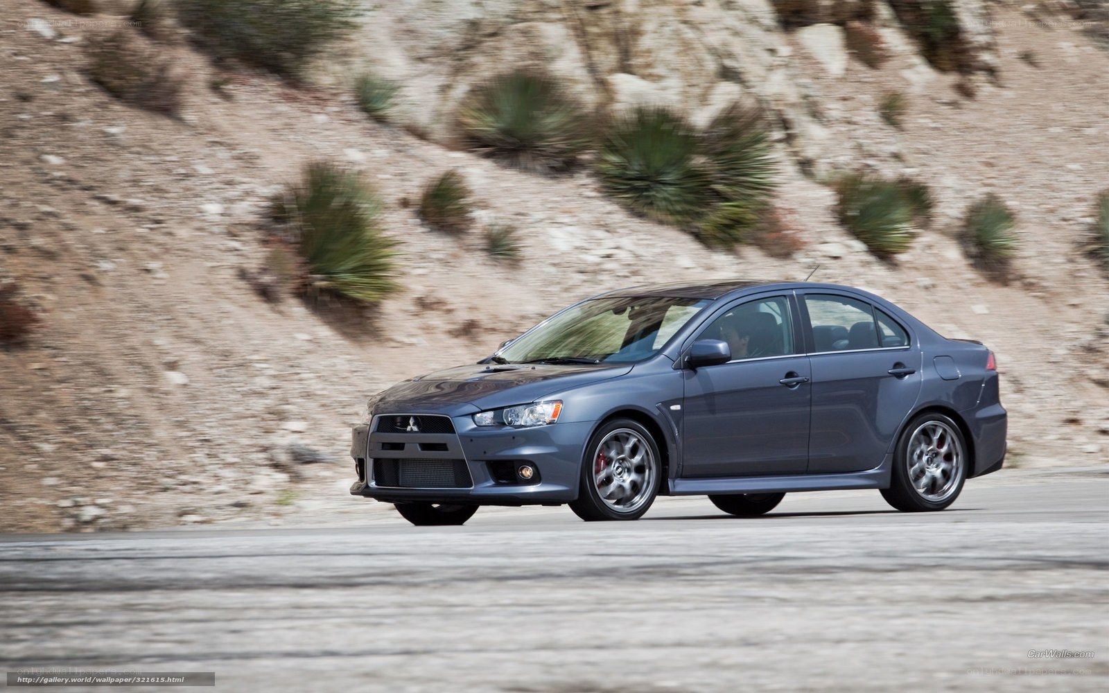 gray mitsubishi lancer in motion