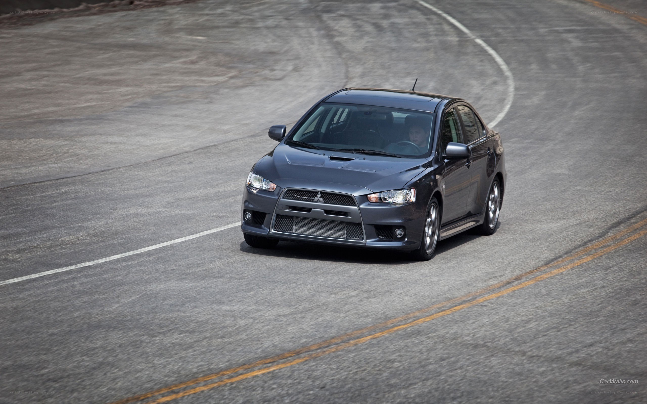 gray mitsubishi lancer on track