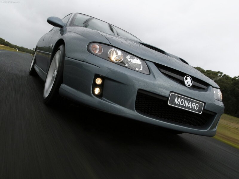 gray monaro driving on road