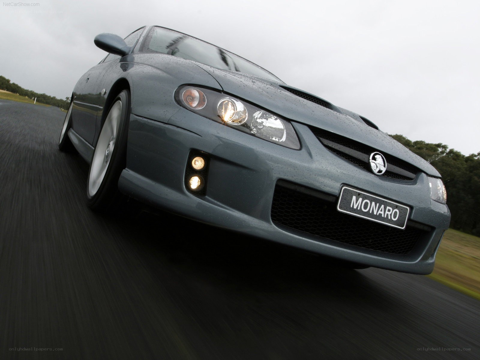 gray monaro driving on road