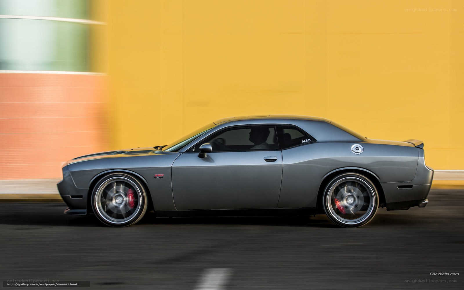 gray muscle car in motion