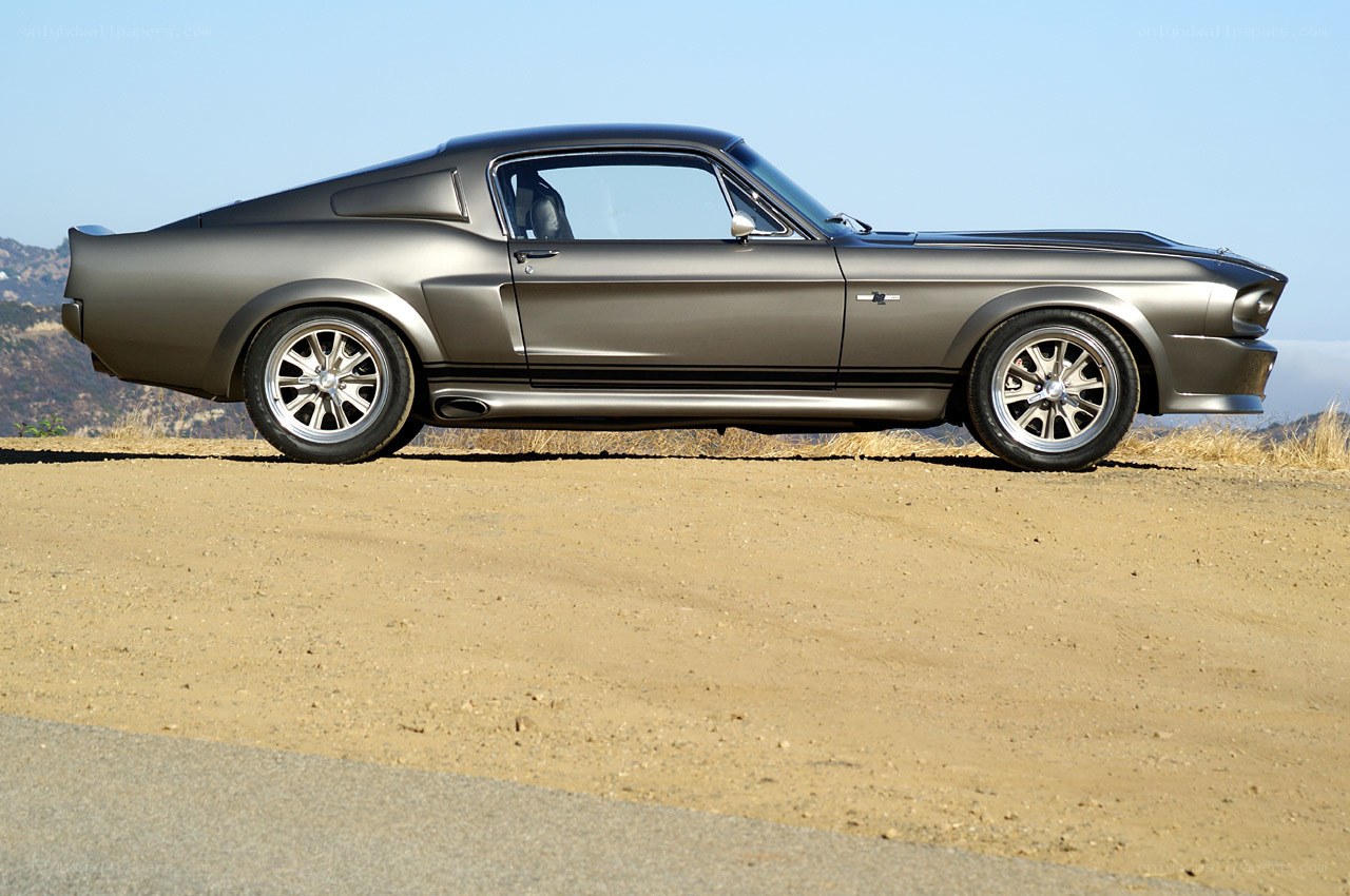 gray muscle car on dirt road