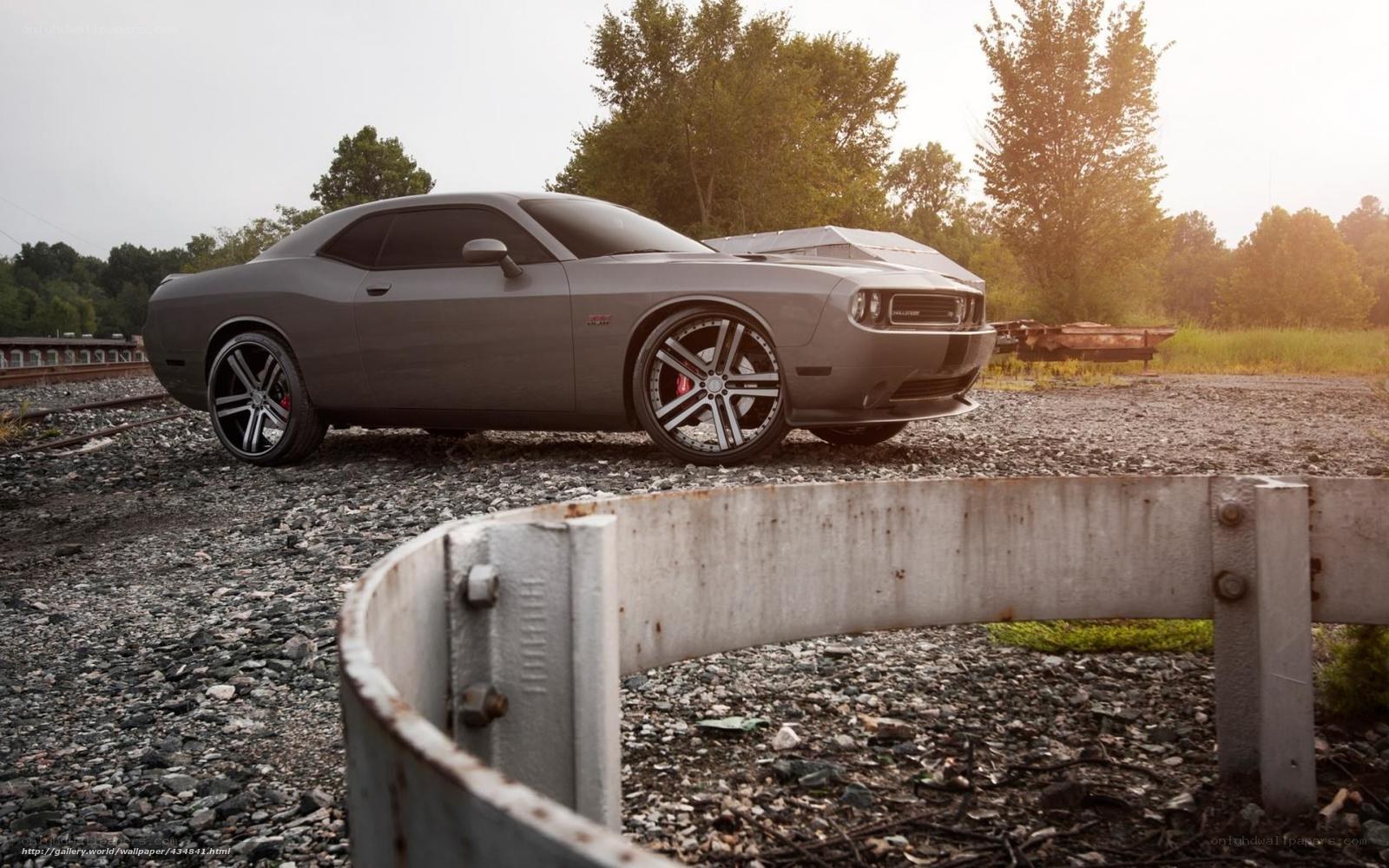 Gray muscle car on gravel