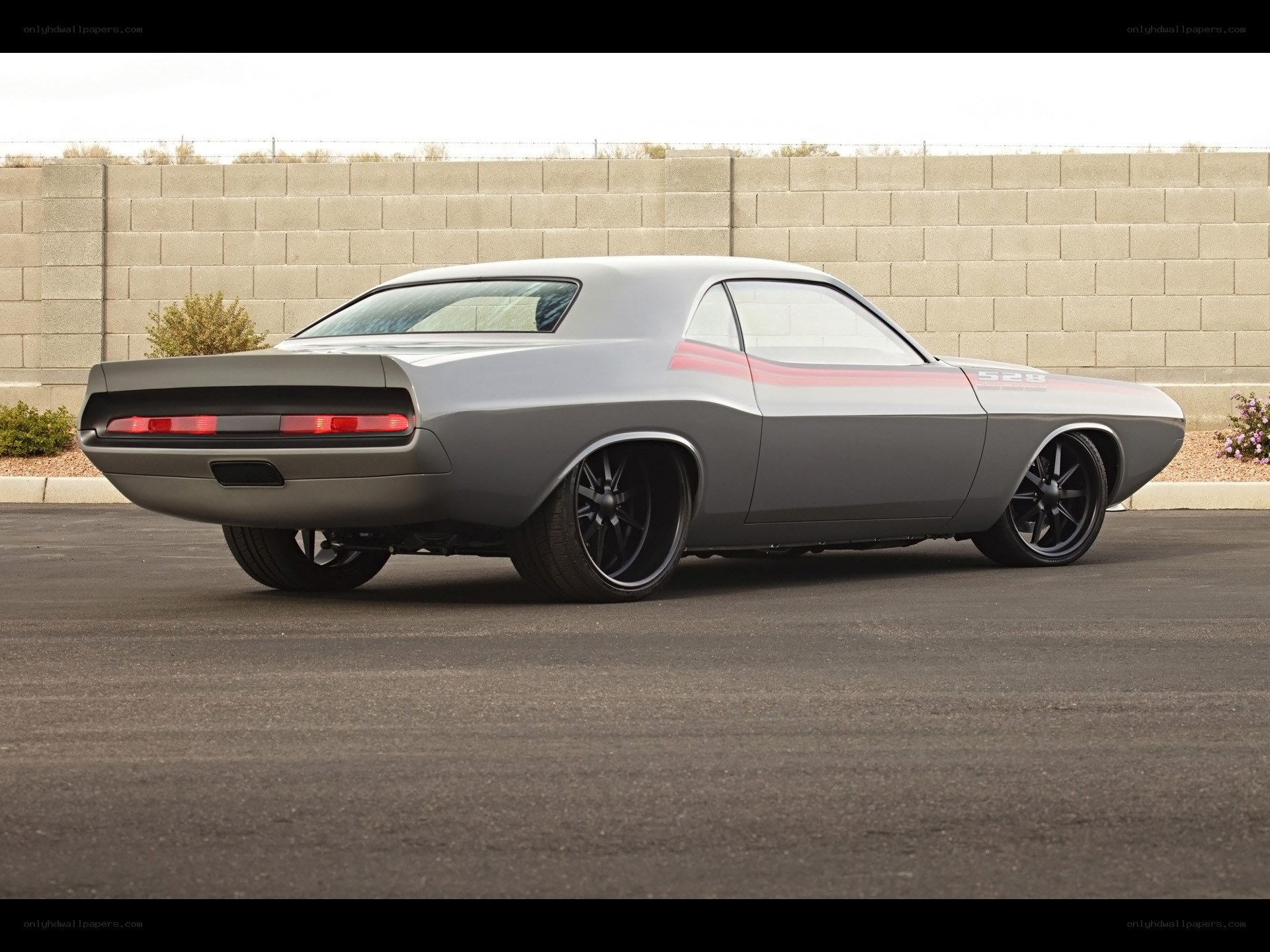 gray muscle car with red stripes