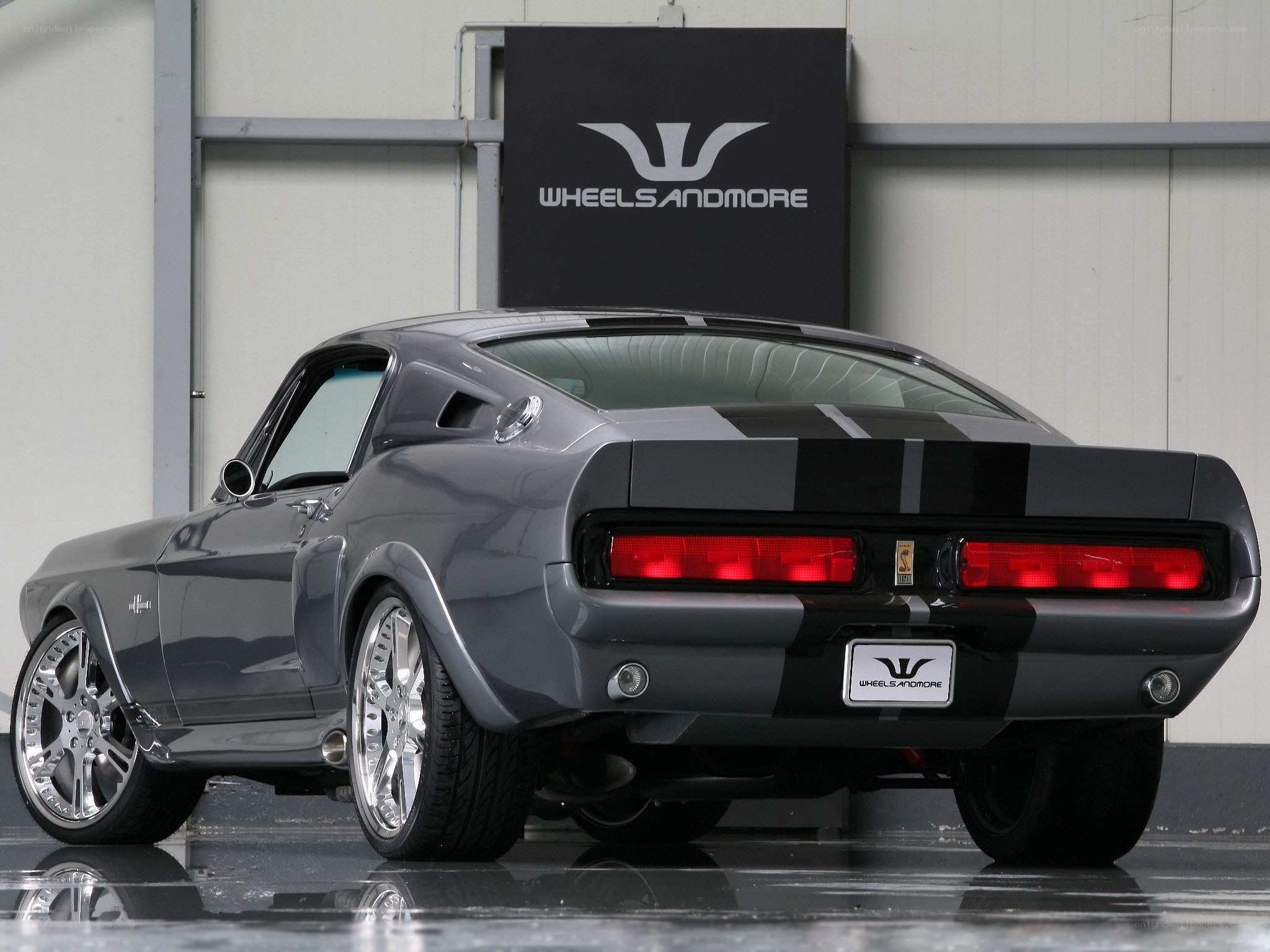gray muscle car with stripes