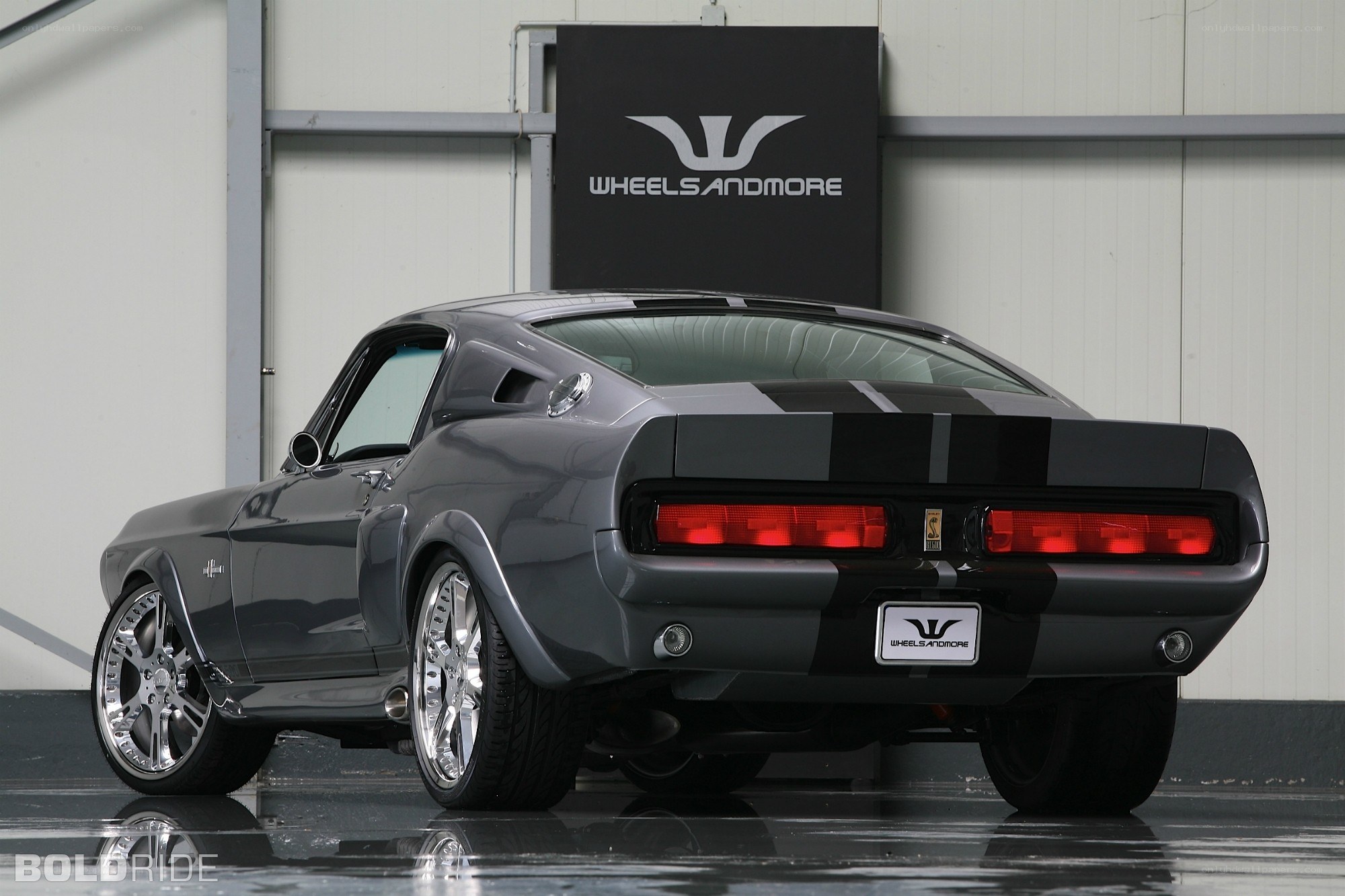 gray muscle car with stripes