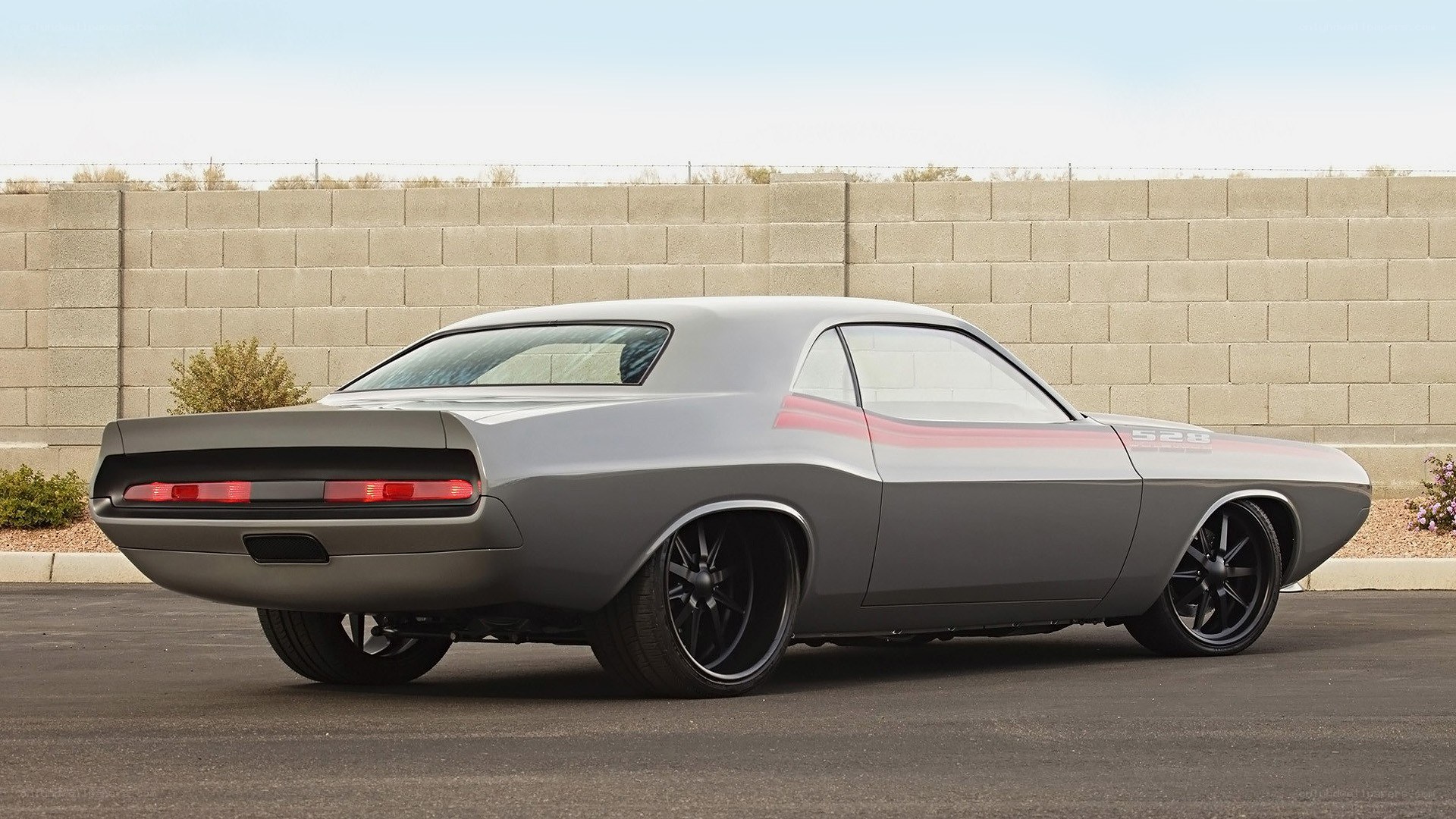 gray muscle car with stripes