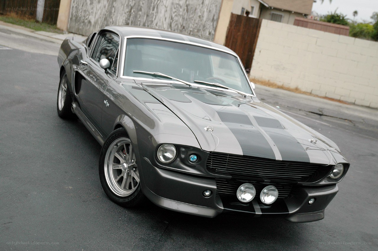 gray muscle car with stripes