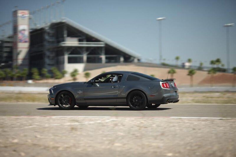 gray mustang on racetrack