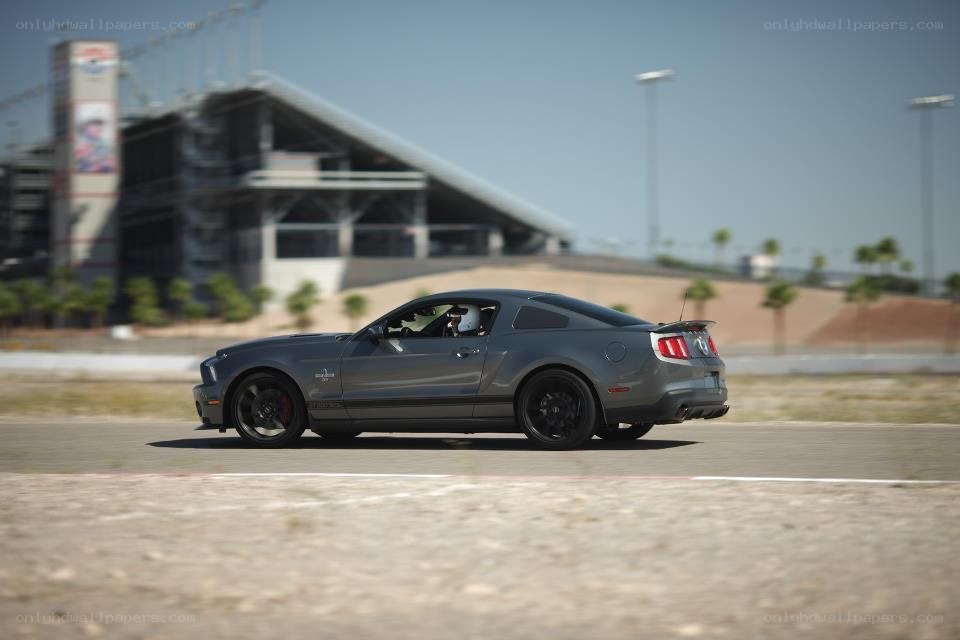 gray mustang on racetrack
