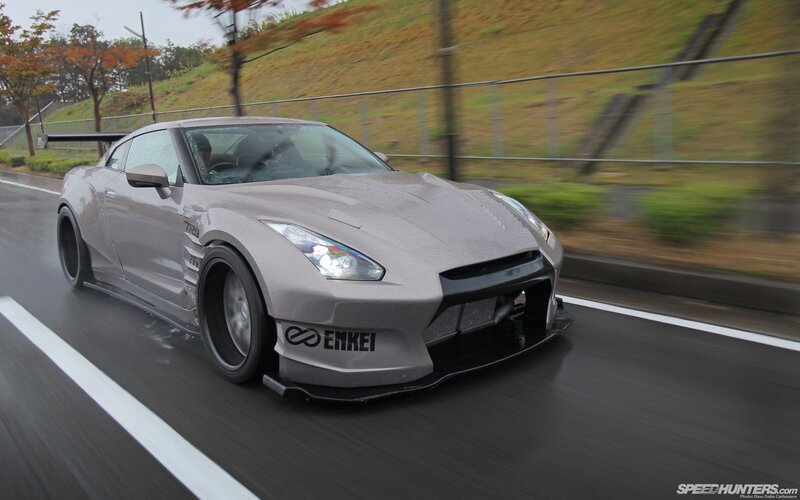 gray nissan gt-r on wet road